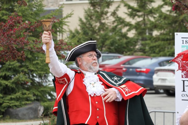 a town crier in traditional costume